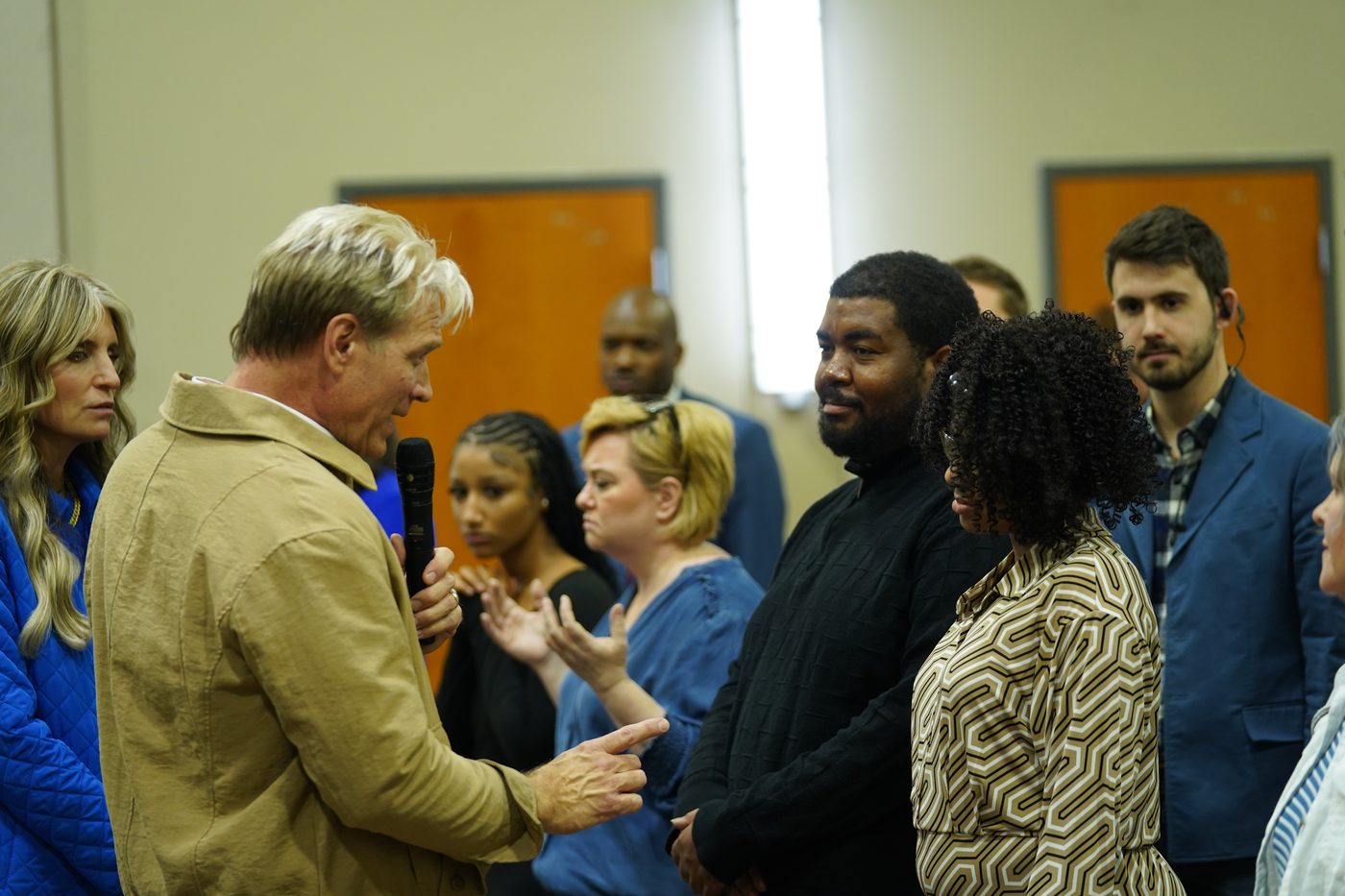 Pastor Stan Pody talking with a couple after a service