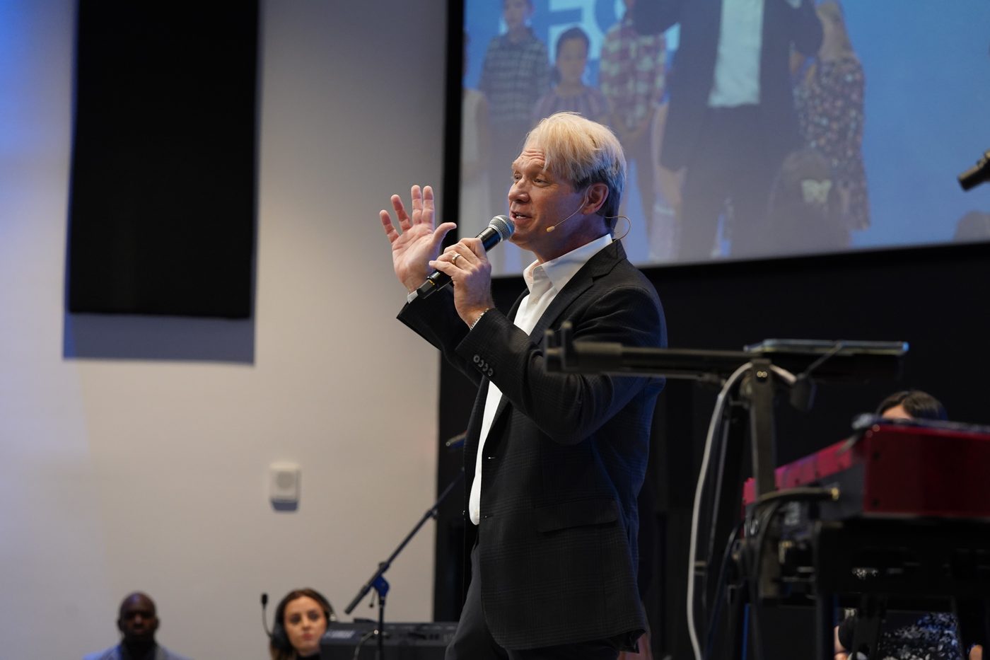 Pastor Stan Pody teaching, headset mic